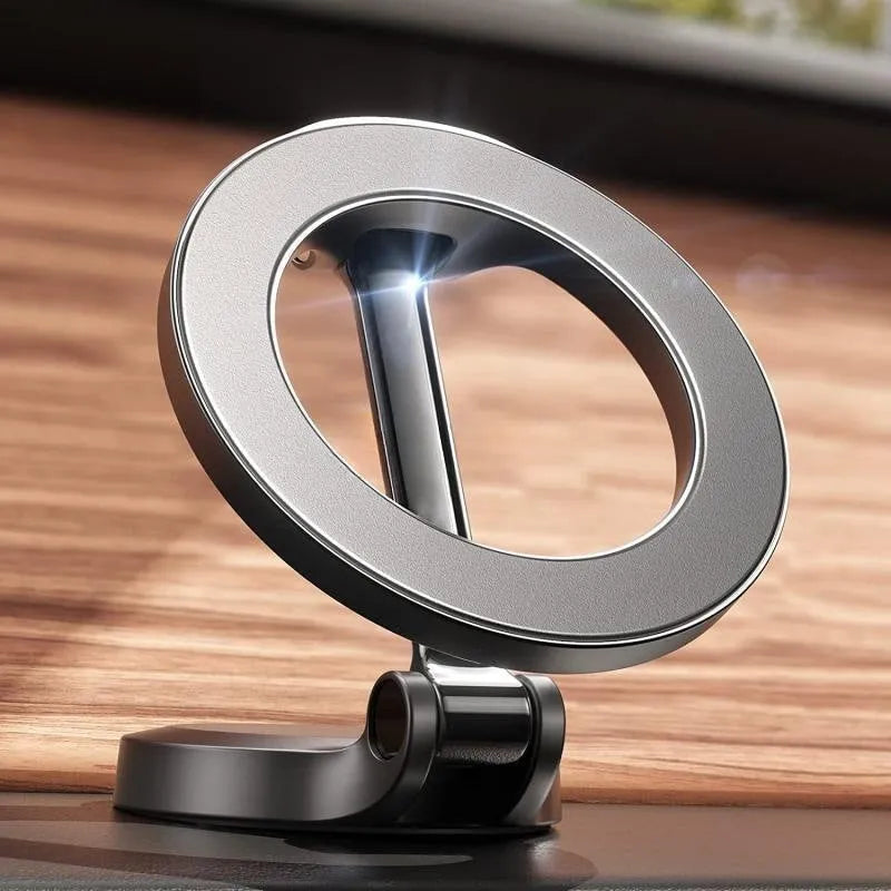 All-metal magnetic car phone mount with foldable design on dashboard holding mobile phone