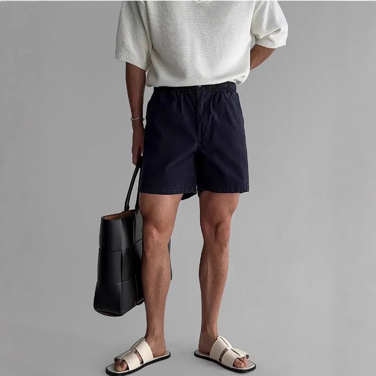 Cotton sports shorts in black colour with loose fit design for summer sports activities