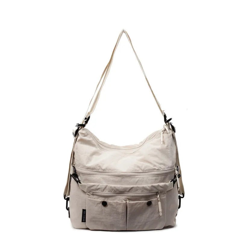 Women's nylon crossbody bag in square vertical shape with double shoulder straps and organised interior compartments