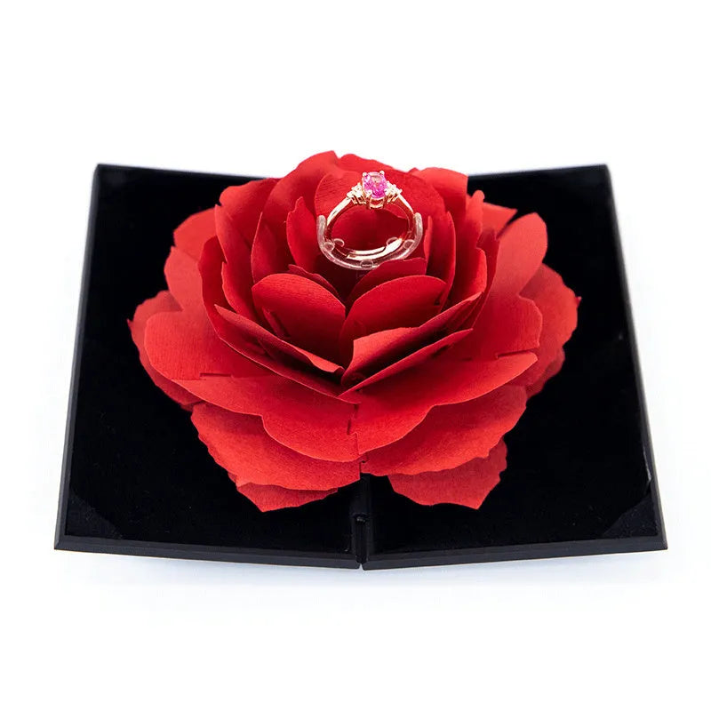 Red rotating ring box with 3D heart-shaped rose decoration for jewellery display