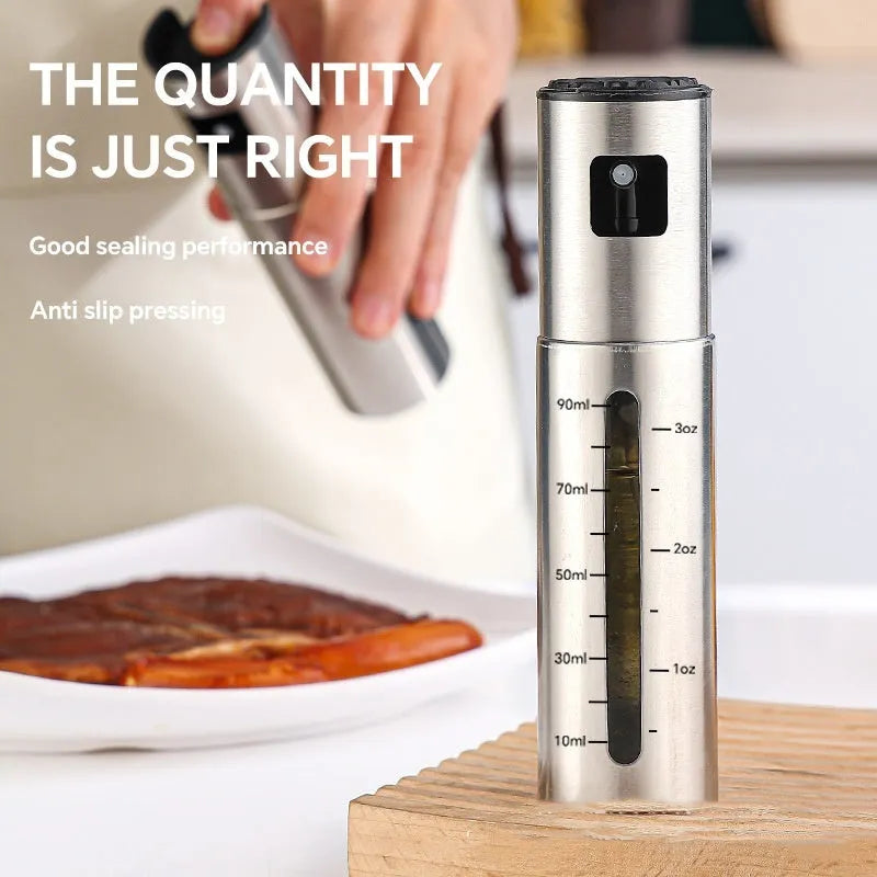 Stainless steel press type oil spray bottle with 100ml glass body and visual scale