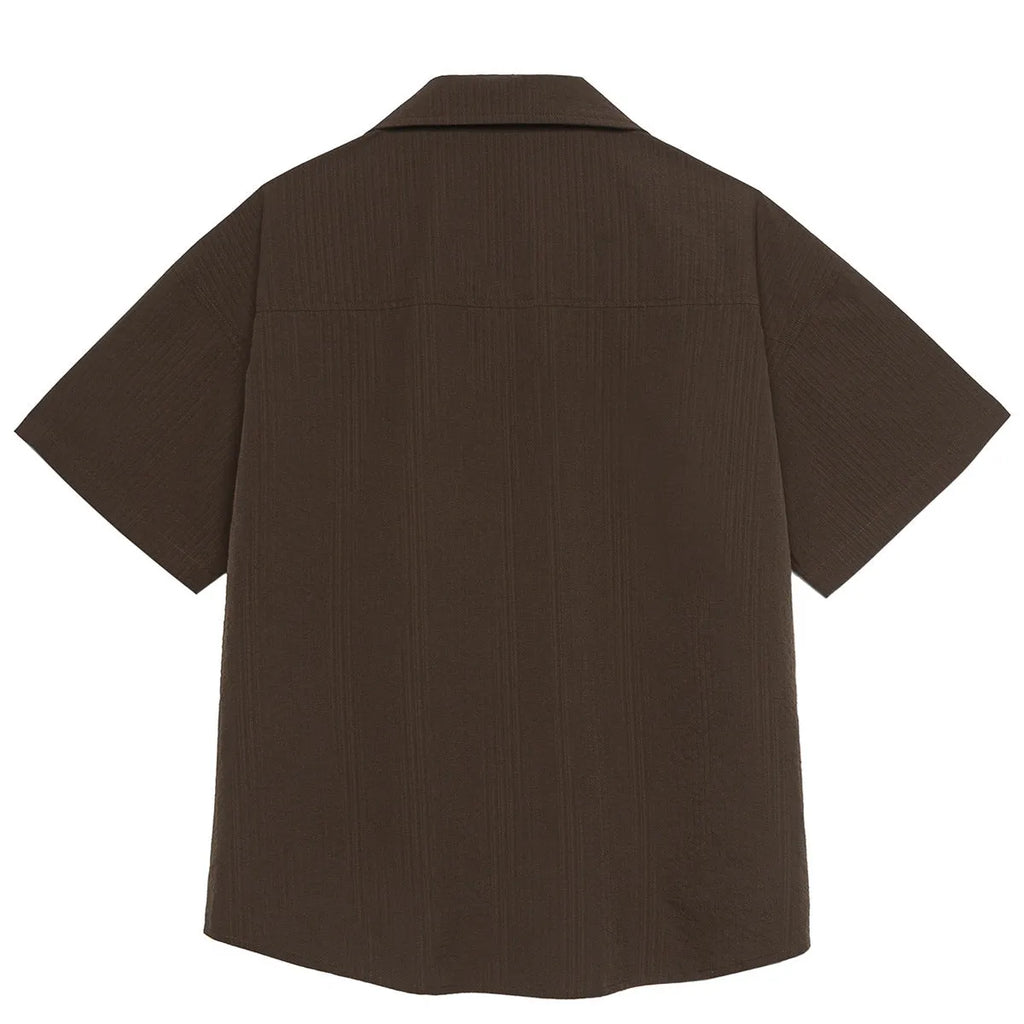 Brown striped men's short sleeve outdoor shirt with a Cuban collar on a hanger