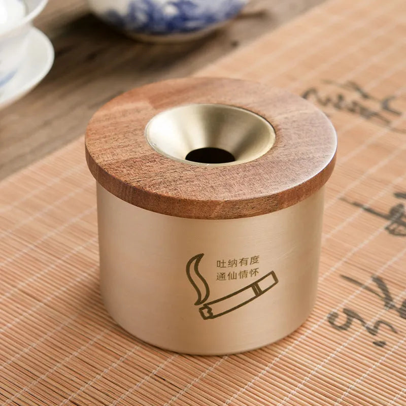Copper retro ashtray with wooden lid showing central hole for ash collection