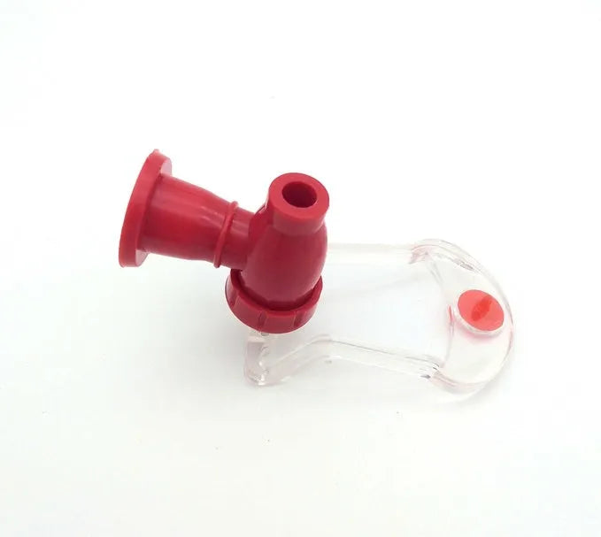 Red plastic Magic Tap soda drink dispenser attached to an inverted 2-litre bottle