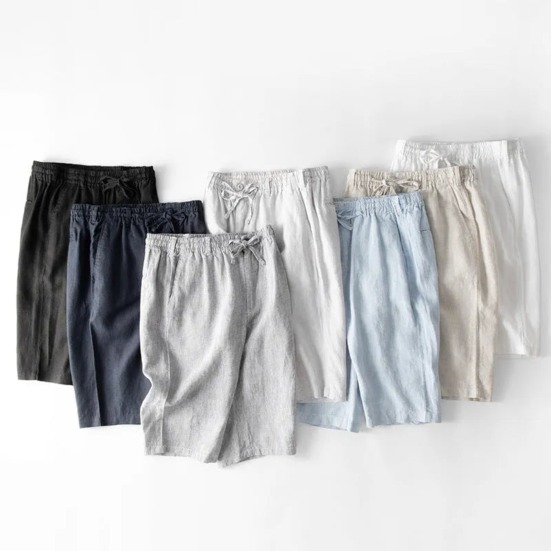 Men's loose-fitting linen capri pants in a light colour, showing the straight-leg style.