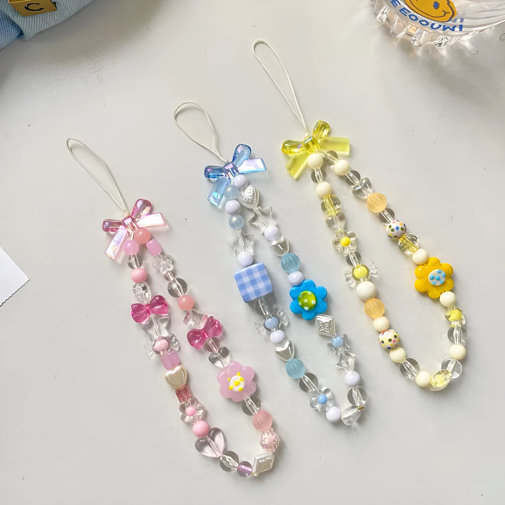 Close-up of a blue flower beaded phone lanyard with a rope strap for carrying mobile phones.
