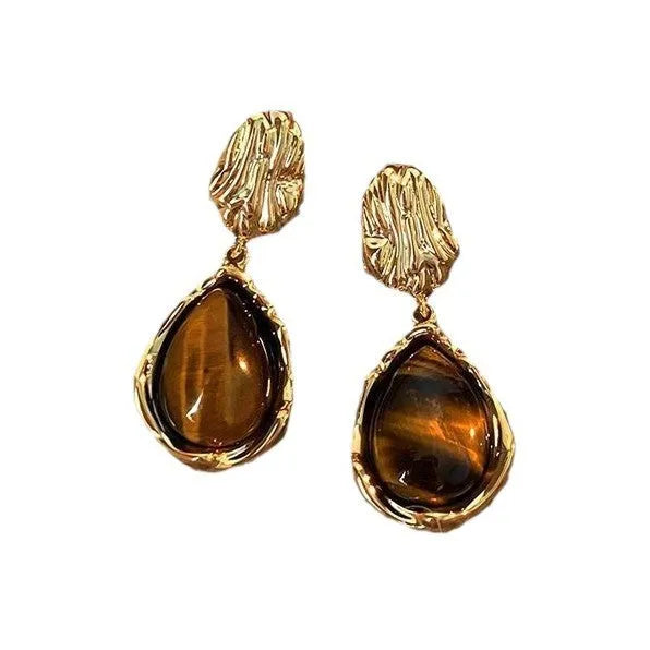 Set of three geometric alloy earrings with tassel detailing in gold, amber and tiger eye colours