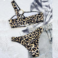 Women's leopard print bikini set with separate top and shorts on a mannequin