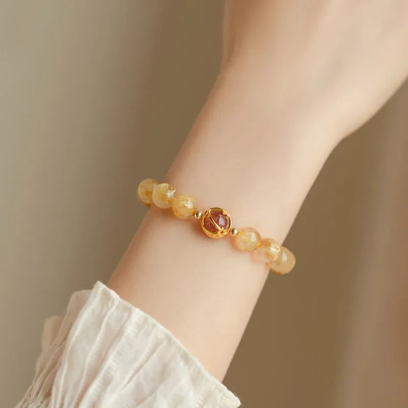 Gold rutilated quartz crystal bracelet with diamond shaped beads in Korean style design