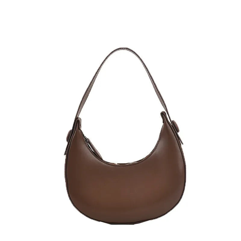 Retro dumpling-shaped women's shoulder bag in PU leather with a front pocket.