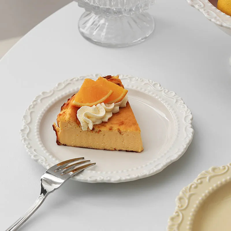Cream ceramic lace vintage plate with irregular shape and coloured glaze, in white or yellow