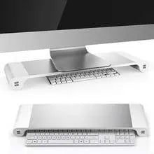Silver and black computer monitor stand with USB ports on the front and a keyboard shelf underneath