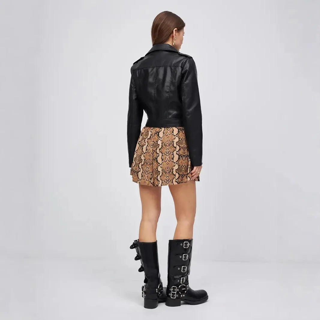 Black women's retro-style imitation leather jacket with a street fashion locomotive design on a model.