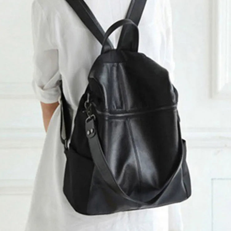 Women's genuine leather retro backpack showing internal organisation compartments and sewing thread detailing