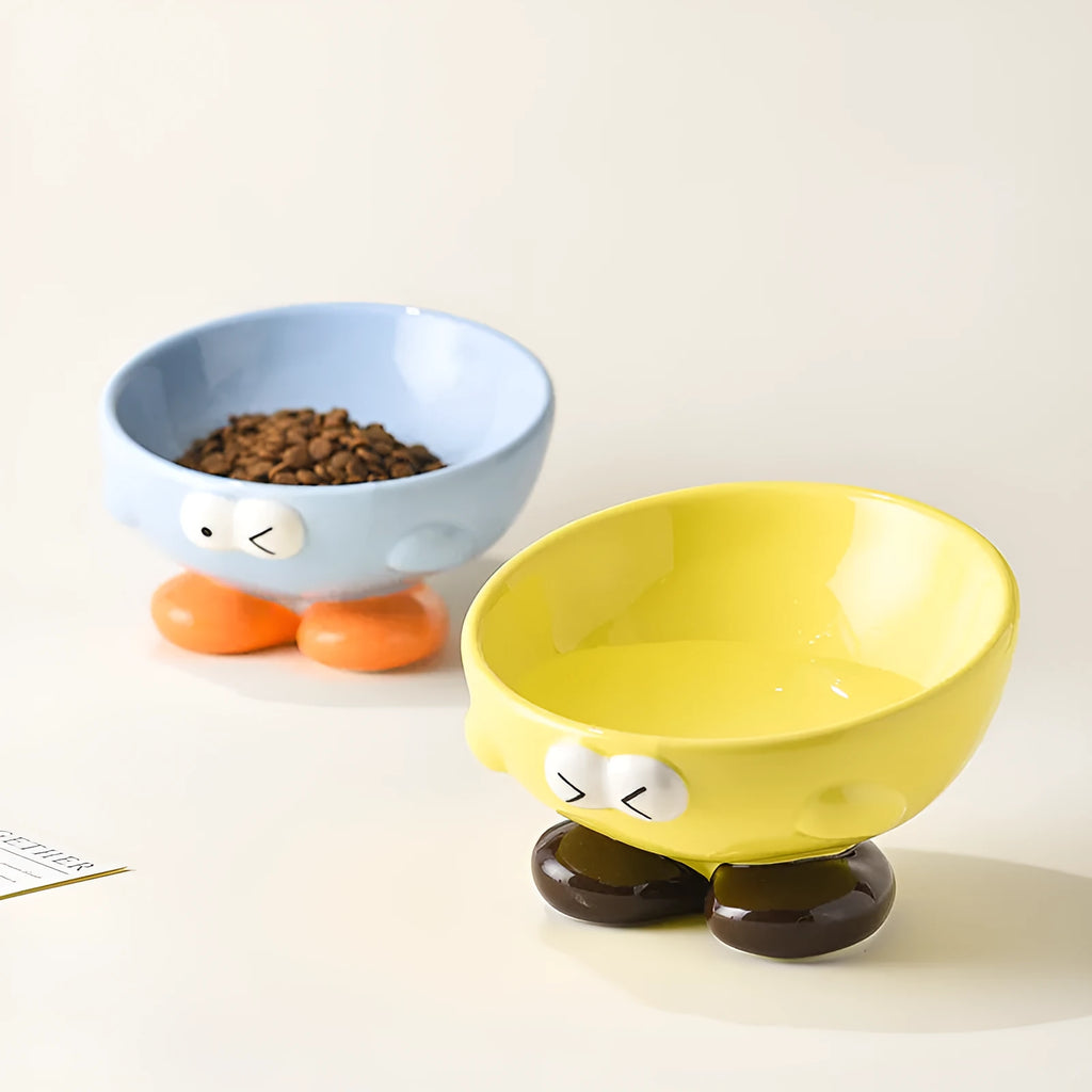 Ceramic slanted pet bowl in blue colour showing oblique design for neck support during feeding