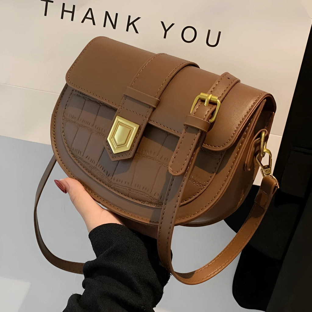 French one shoulder saddle bag for women with lock and stone pattern, available in beige
