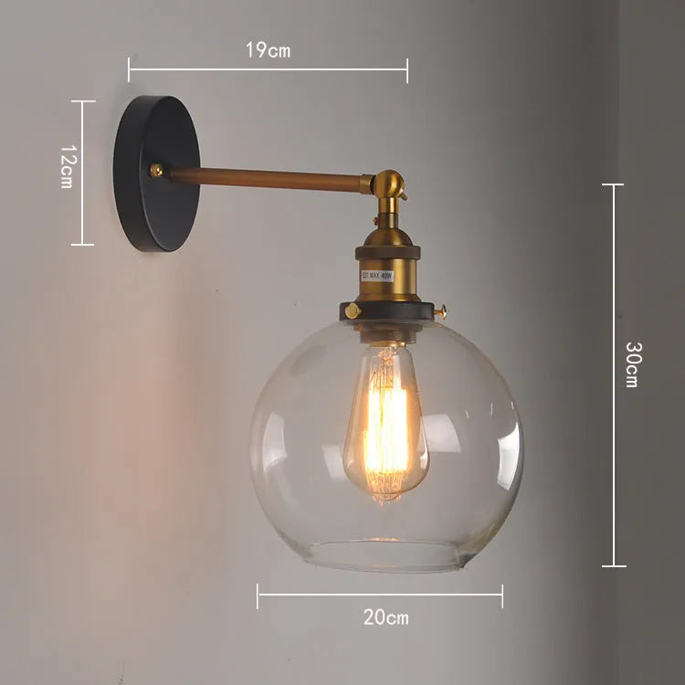 20cm round glass ball wall lamp with aluminium holder in amber, smoke grey, or transparent.