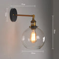 20cm round glass ball wall lamp with aluminium holder in amber, smoke grey, or transparent.
