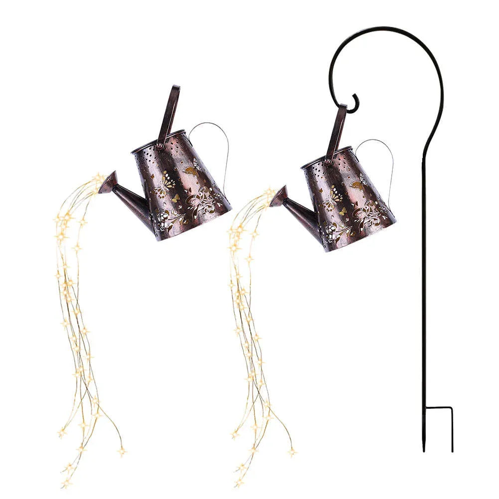 Iron solar garden lamp with a tapered butterfly silhouette emitting warm white light.