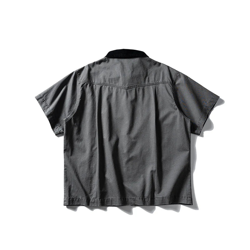 A khaki-coloured, loose-fitting, short-sleeved cotton shirt styled as washed overalls for teenagers