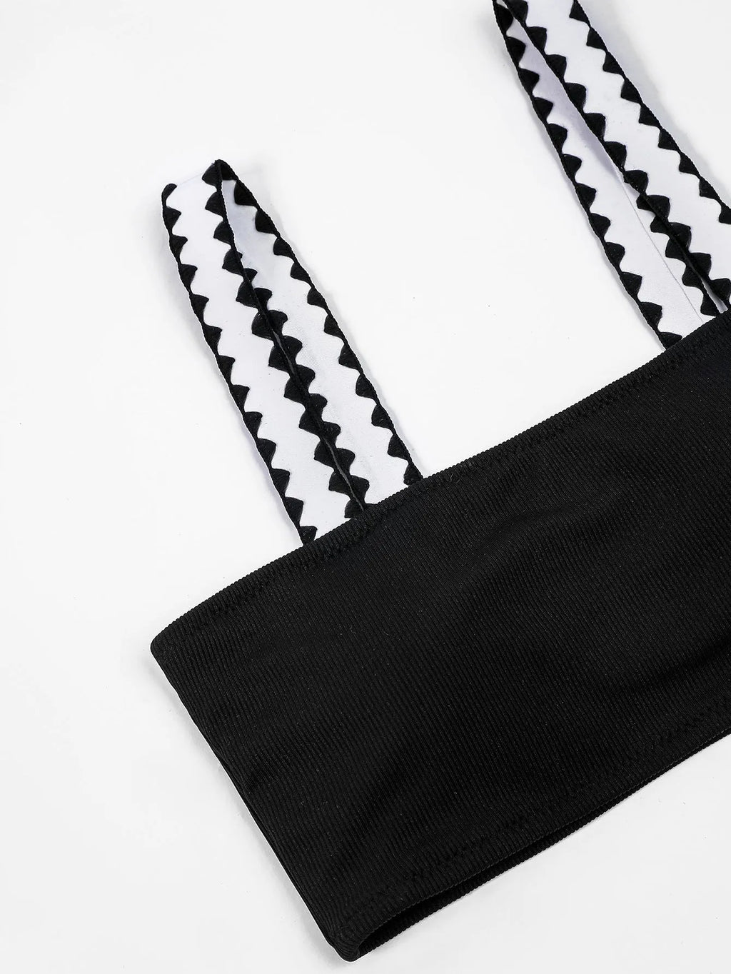 Black women's bikini swimsuit with a hollowed-out split design and brief style.