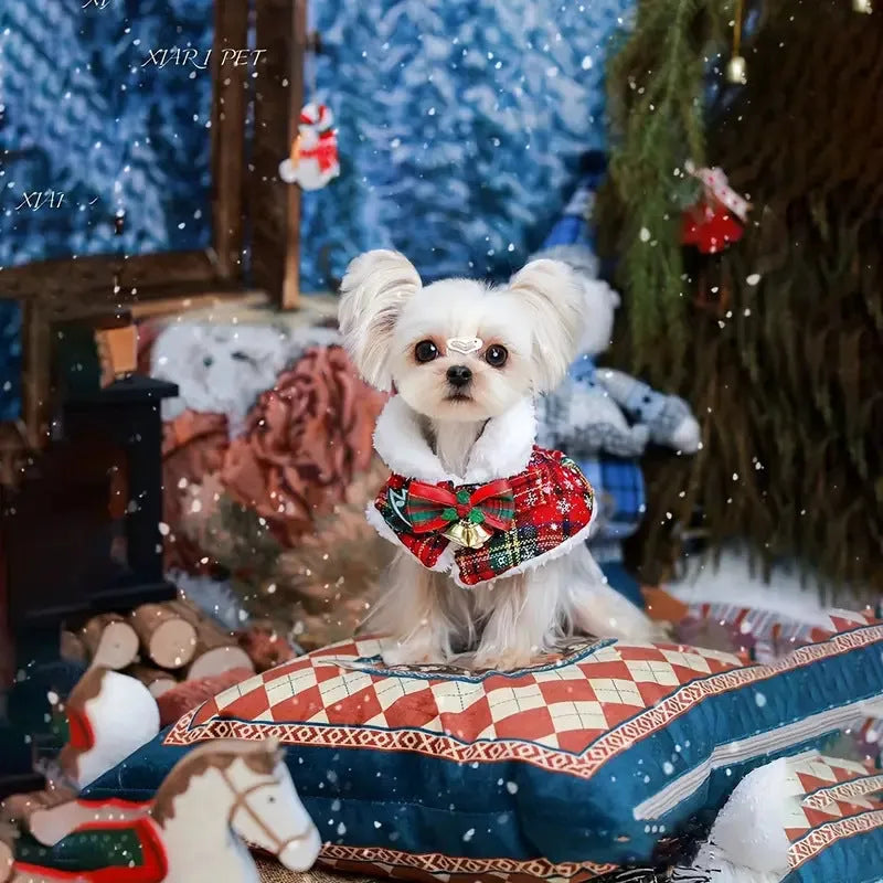 Red festive pet scarf with bell print draped on a dog's neck for winter and Christmas.