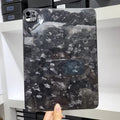 Genuine carbon fibre hard protective case for Apple iPad Pro 11 on a table.