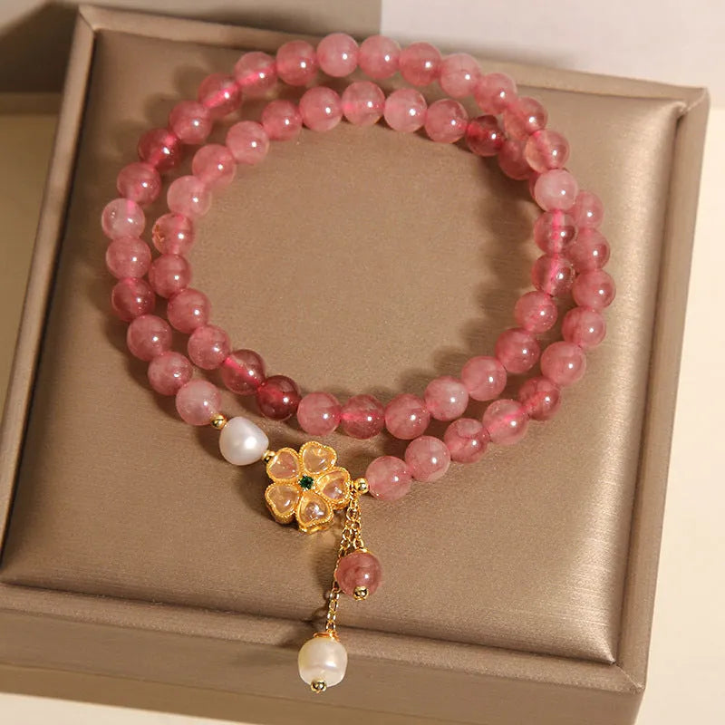 Women's twin ring bracelet with strawberry quartz four-leaf clover charms in Japanese Korean style