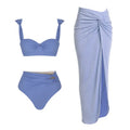 Women's one-piece swimsuit with attached skirt featuring gold buttons in black, blue, brown and pink colours