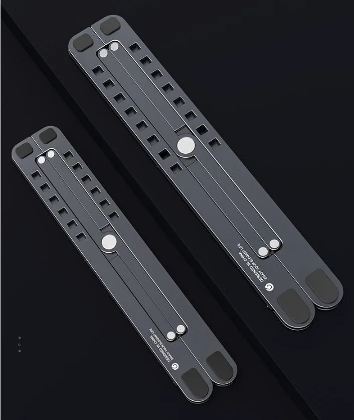Foldable aluminium laptop stand in silver, shown open at an angle and folded flat.