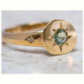 Golden zinc alloy ring with an adjustable opening and a star-shaped zircon asterism design.
