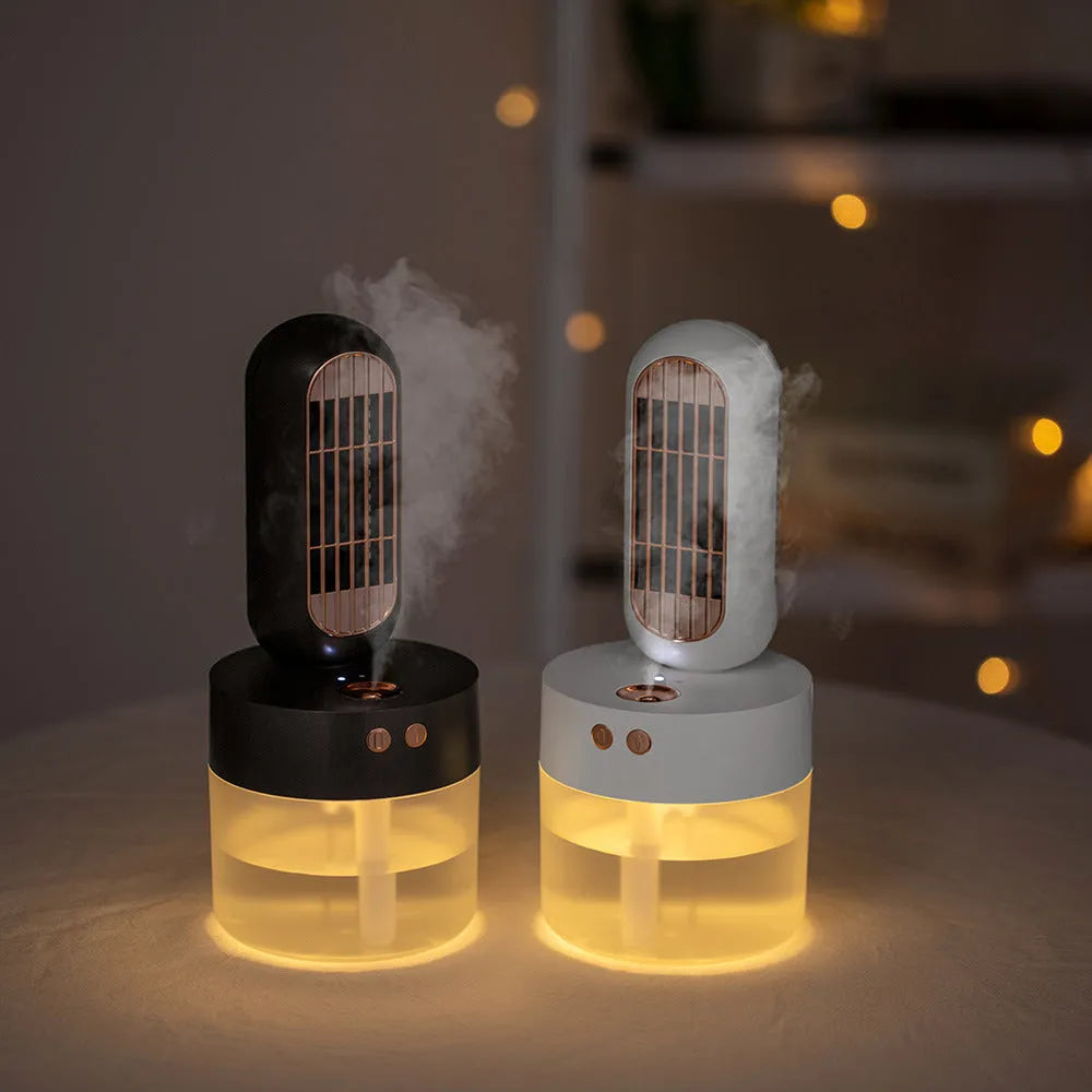 Small black and white oscillating humidifier fan with mechanical controls on desktop