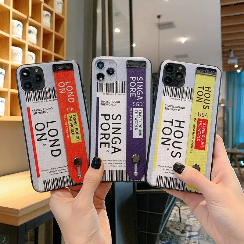 Red TPU and PC mobile phone case for Apple iPhone with attached wristband.