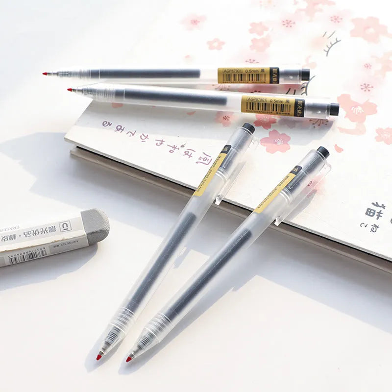 Twelve retractable gel pens with frosted black barrels and 0.5mm tips displayed with two refill units
