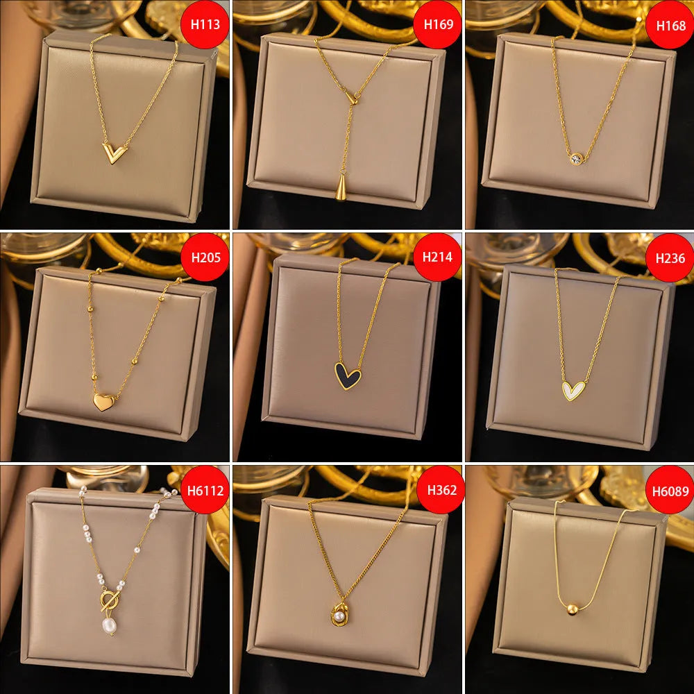 Gold titanium steel necklace with double ring pendant on a regular chain, listed as 37 H6012