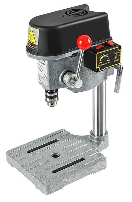 Mini bench drill and milling machine on a workbench with bench pliers.