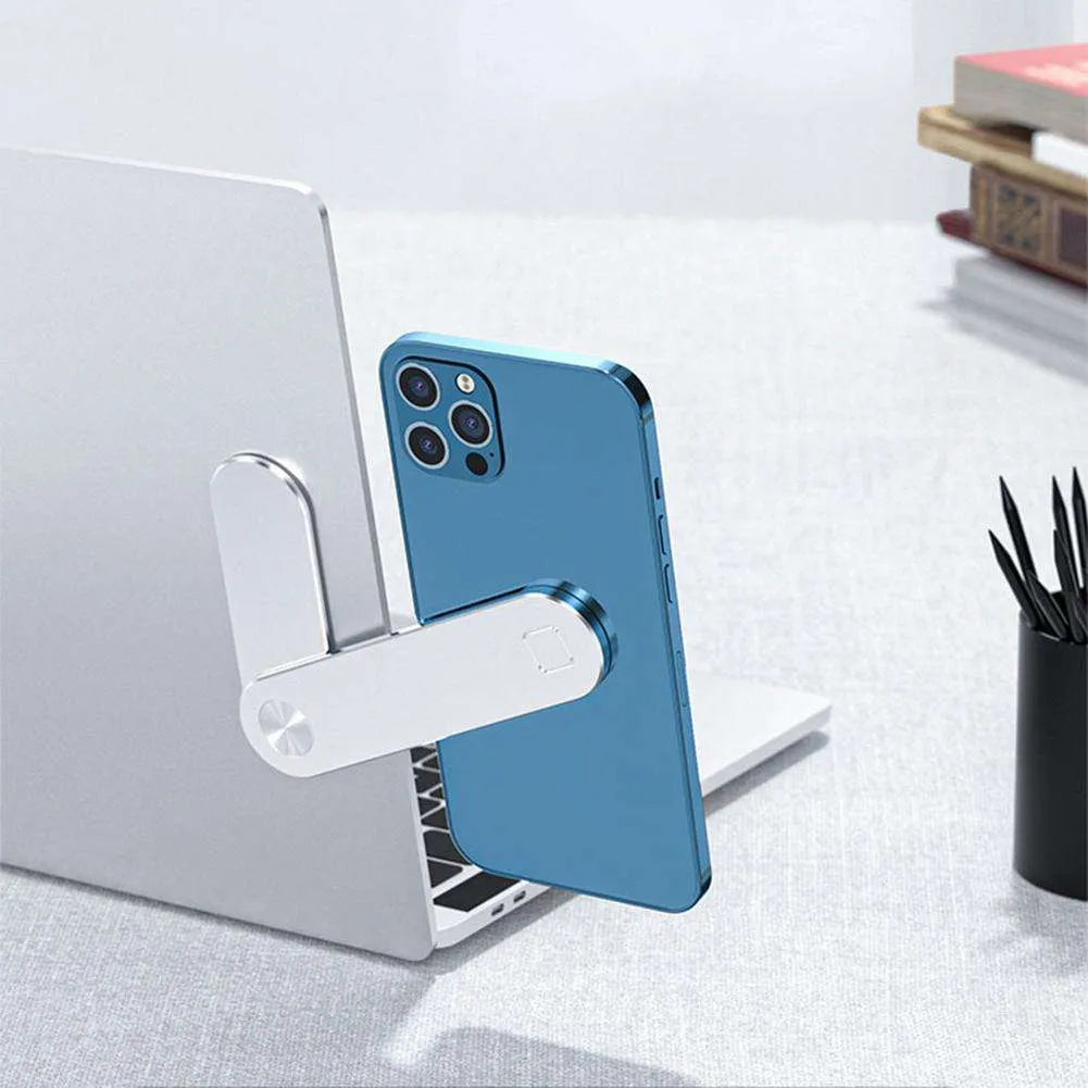 Black aluminum laptop phone holder with magnetic bracket mounted beside computer monitor