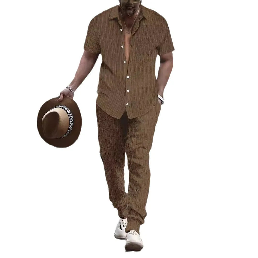 Men's loose-fit casual shirt and trousers suit in a cotton blend fabric, shown in a light blue colour.