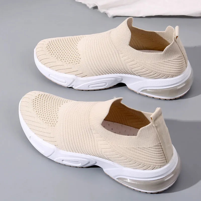 Slip-on breathable sock shoes in black, pink, khaki, and white with mesh lining and PVC sole.
