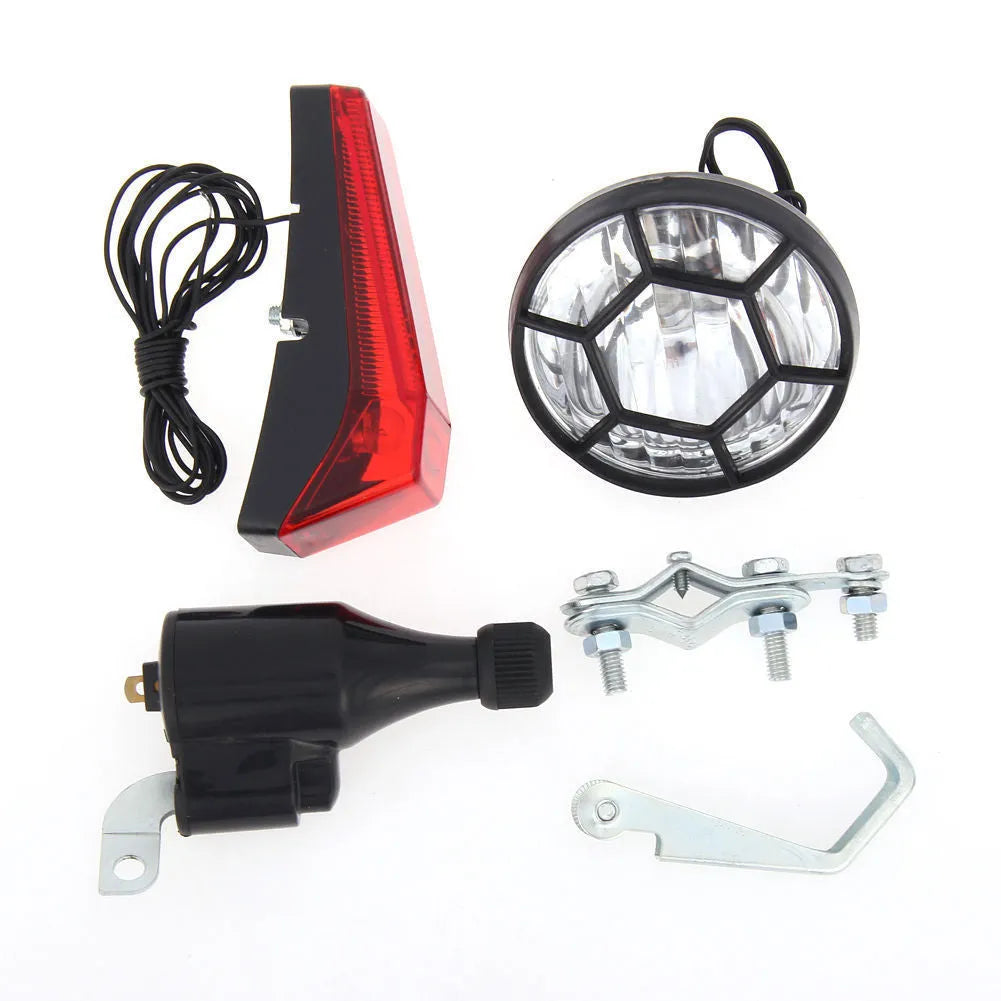 Silver bicycle dynamo generator light modification kit showing mounting bracket and wiring connections