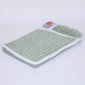 Large grey dog bed mat with removable cover shown next to a sleeping dog, demonstrating its size.
