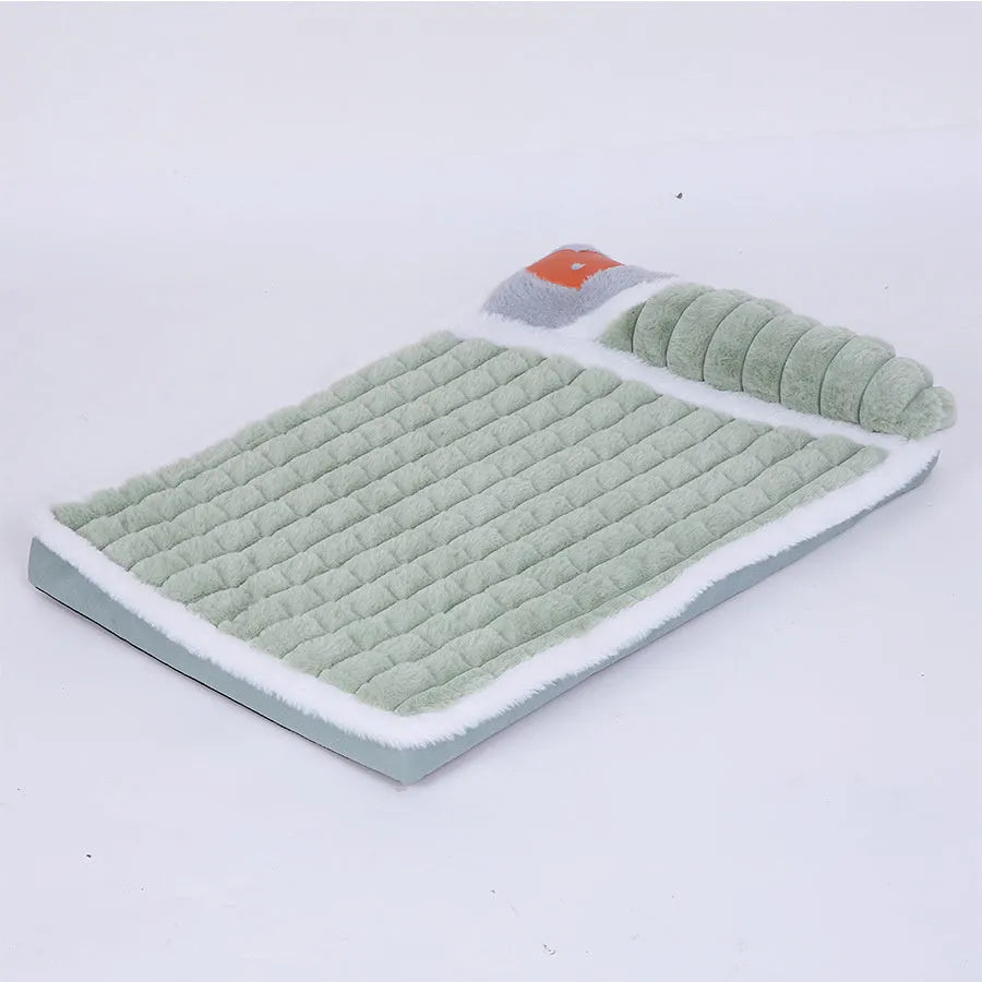 Large grey dog bed mat with removable cover shown next to a sleeping dog, demonstrating its size.