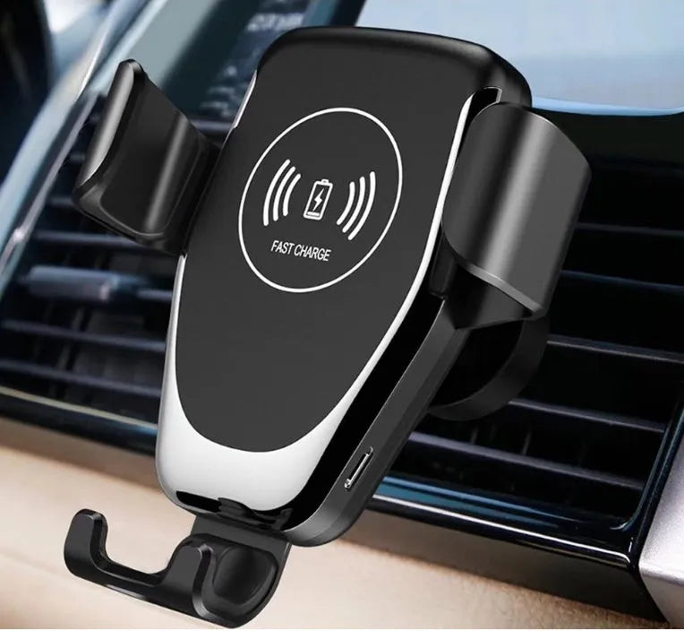 Black car wireless charger mounted on ventilation vent with iPhone Xs charging automatically