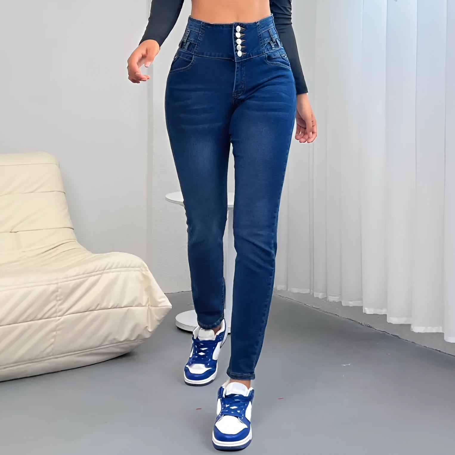 Dark blue women's straight-leg jeans with button accents and zipper closure