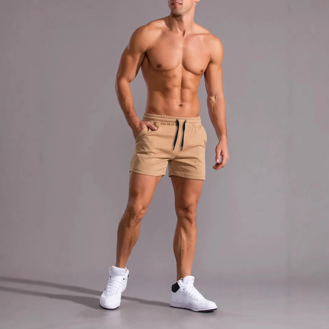 Men's black, khaki and light brown drawstring elastic shorts laid flat, 3-piece set