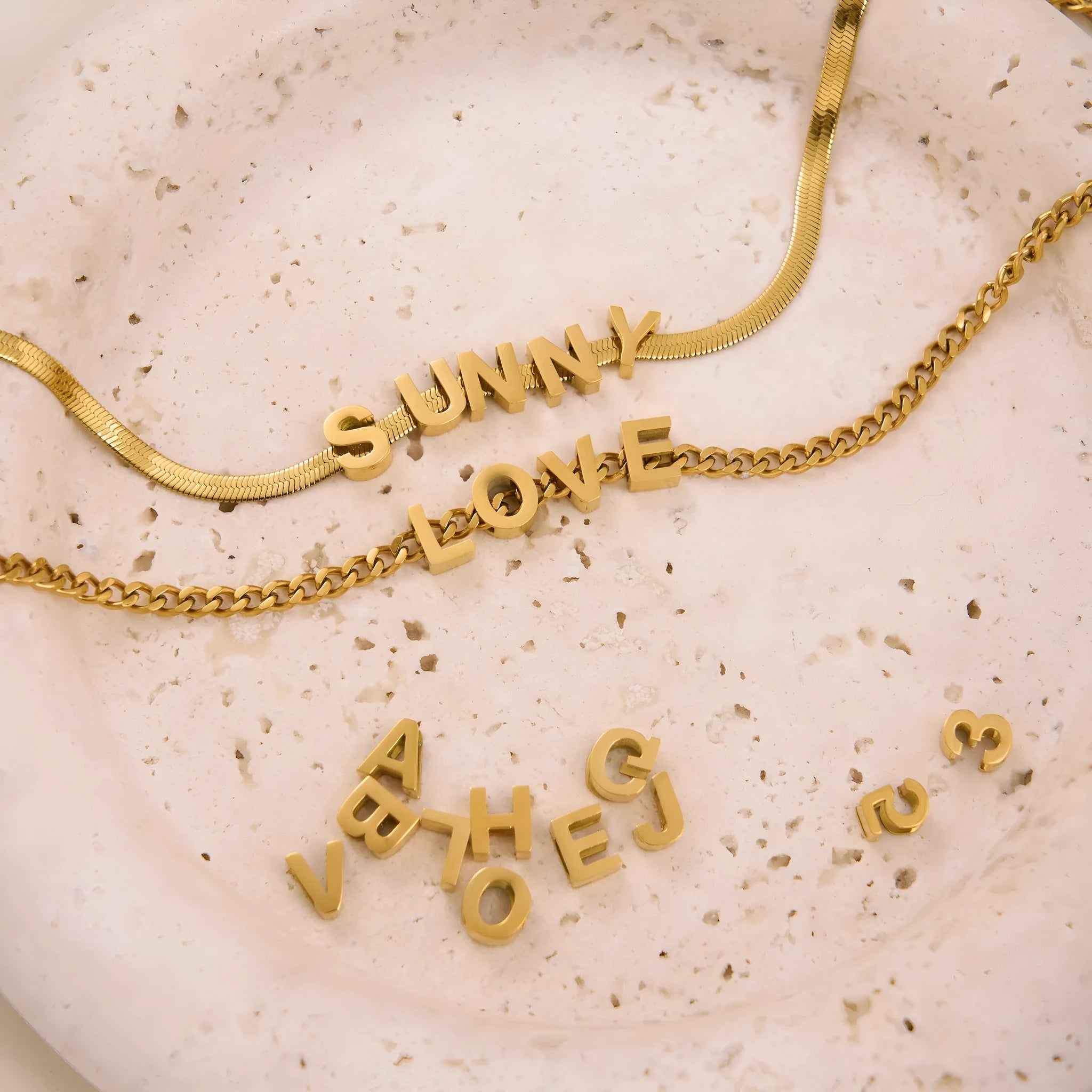 Gold electroplated titanium steel necklace showing letter A pendant on a 40.5cm blade chain