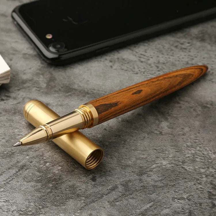 Brass sandalwood signature pen with wood grain visible on 14cm long writing instrument