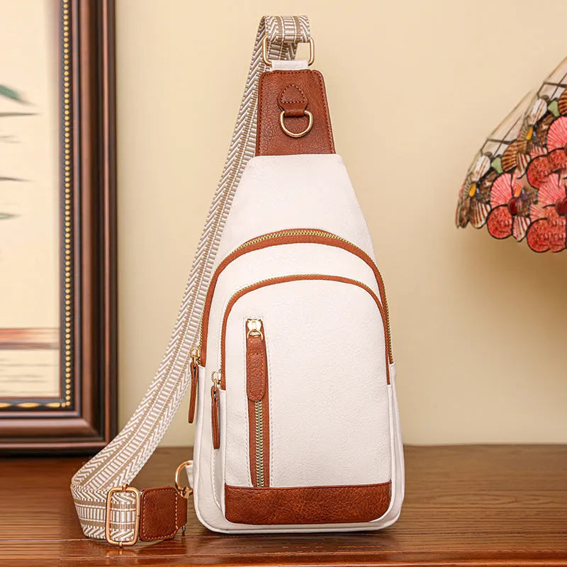 Soft brown PU leather women's crossbody chest bag with open front pocket.