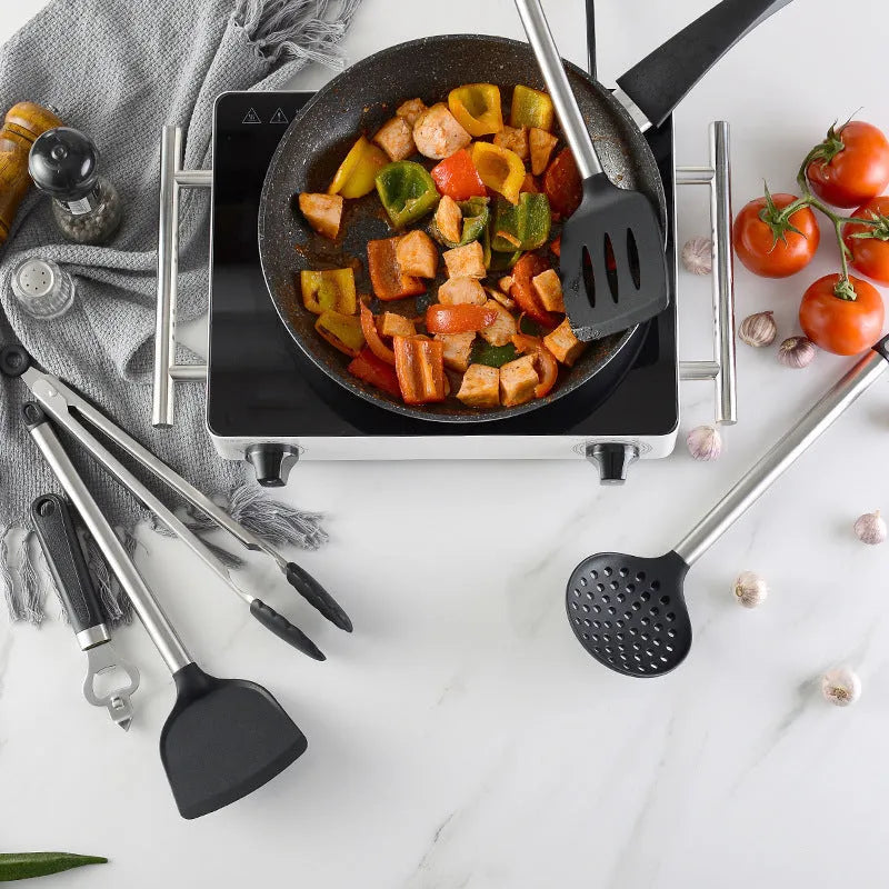 Black silicone spatula set with stainless steel handles containing 16 kitchen utensils