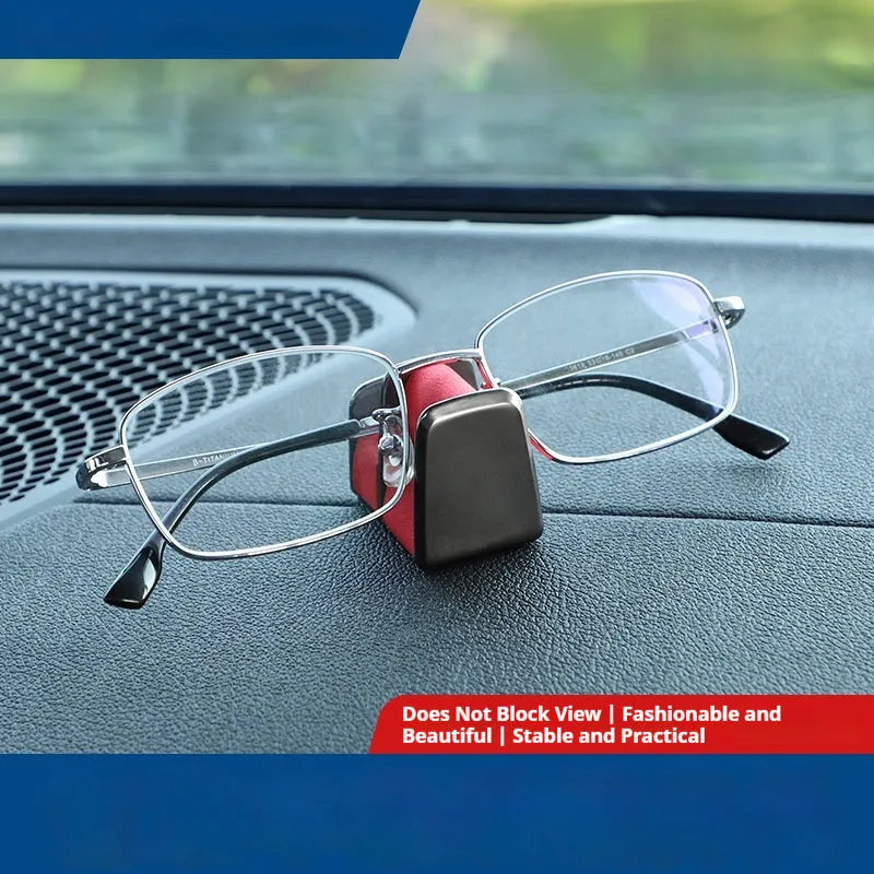 Zinc alloy and leather car dashboard glasses clip holder in green, shown on a car dashboard.